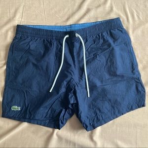 EUC Blue Lacoste swim trunks, size M.